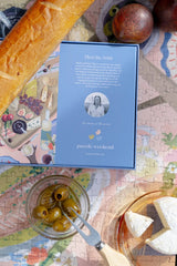 Puzzle box with a portrait on a table with food items