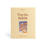 pop the bubbly 1000 piece jigsaw puzzle by piecework puzzles