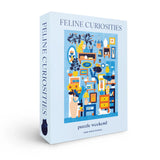 Puzzle box titled 'Feline Curiosities' with colorful illustration on a white background