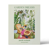 Garden Dreams puzzle packaging with illustrations of a garden scene and text.